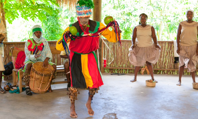 In traditional costumes, Garifuna dancers show their cultural roots at Yubu Garifuna Experience. Roatan, Honduras